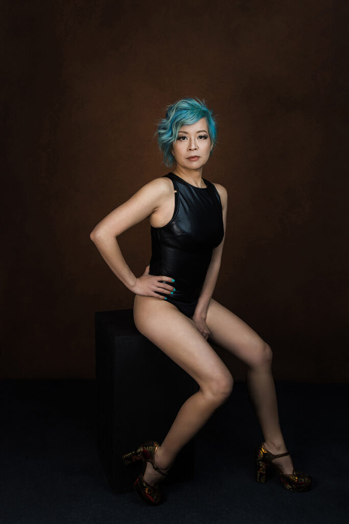 Beautiful bridal boudoir photo of bride in elegant lingerie, posed in natural light and studio light.