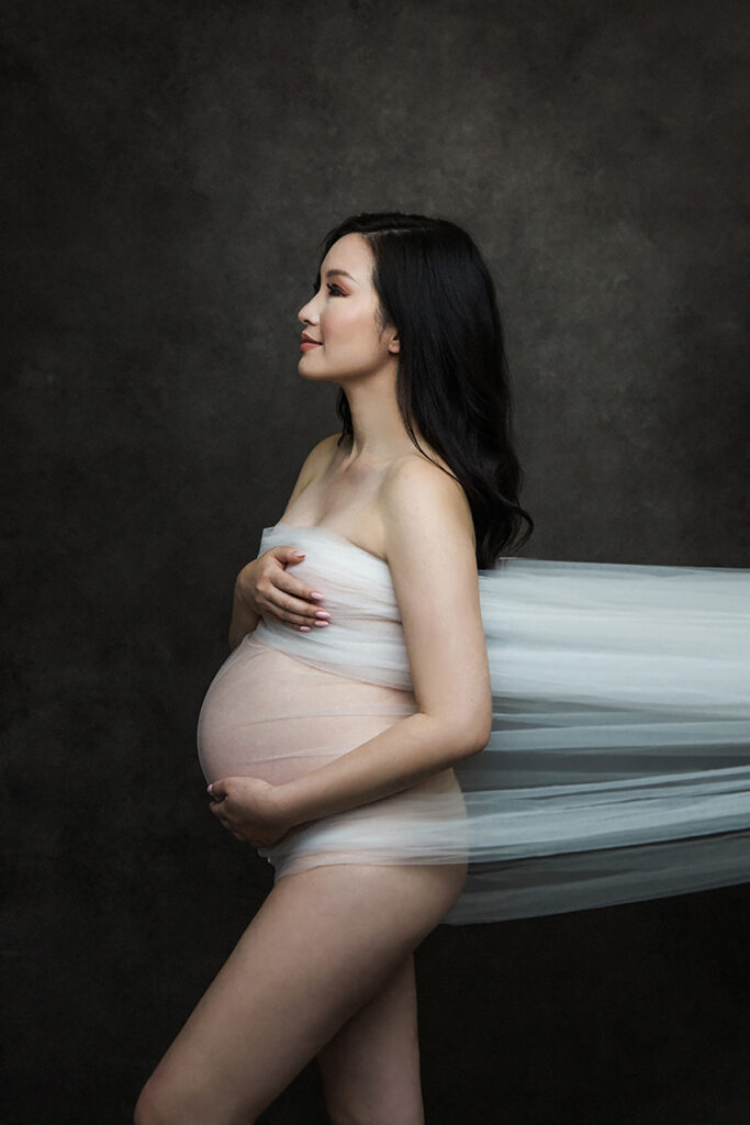 Embrace the beauty of your pregnancy with our glamorous maternity boudoir shoot in Vancouver. Our experienced photographer captures the elegance and sensuality of your maternity journey, creating stunning portraits that celebrate your motherhood in style. Indulge in a personalized and intimate photography experience that empowers you to embrace your pregnancy glow. Contact us now to book your unforgettable glamour maternity boudoir shoot.