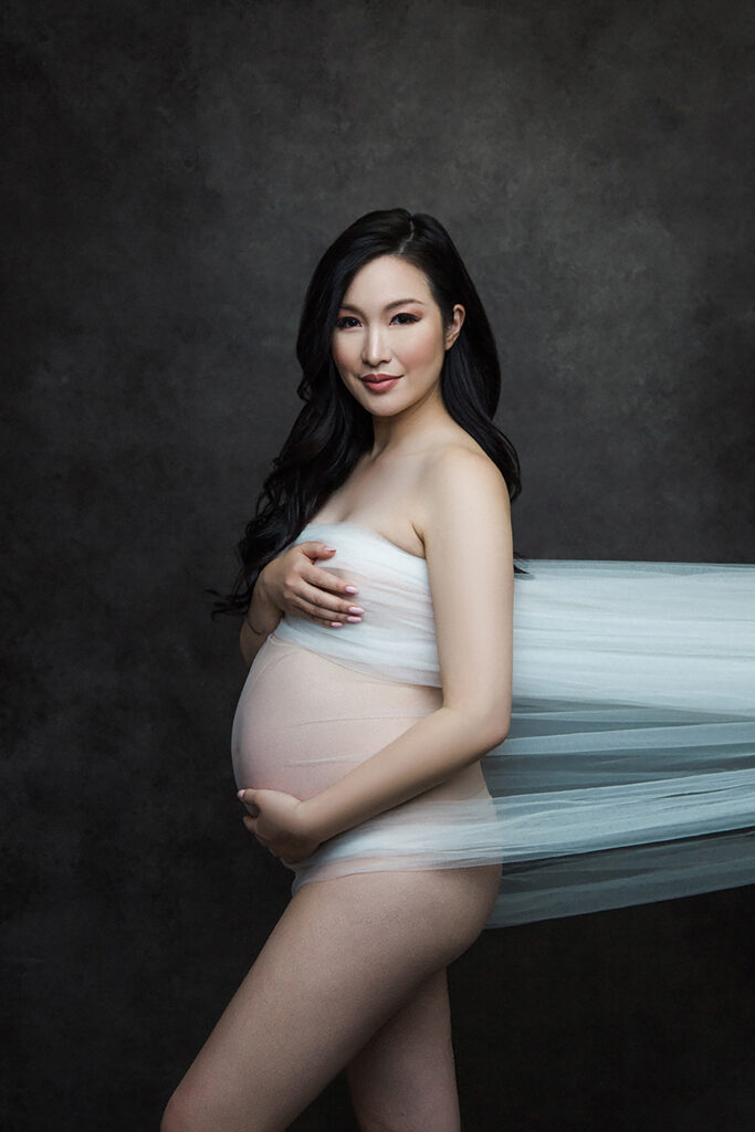 Embrace the beauty of your pregnancy with our glamorous maternity boudoir shoot in Vancouver. Our experienced photographer captures the elegance and sensuality of your maternity journey, creating stunning portraits that celebrate your motherhood in style. Indulge in a personalized and intimate photography experience that empowers you to embrace your pregnancy glow. Contact us now to book your unforgettable glamour maternity boudoir shoot.